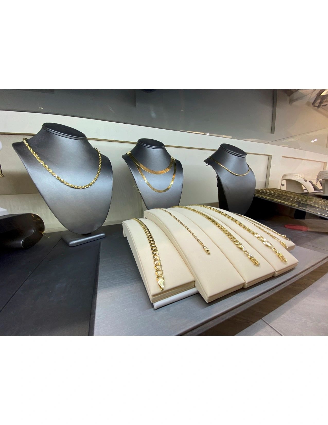 Gold chain necklace jewelry display